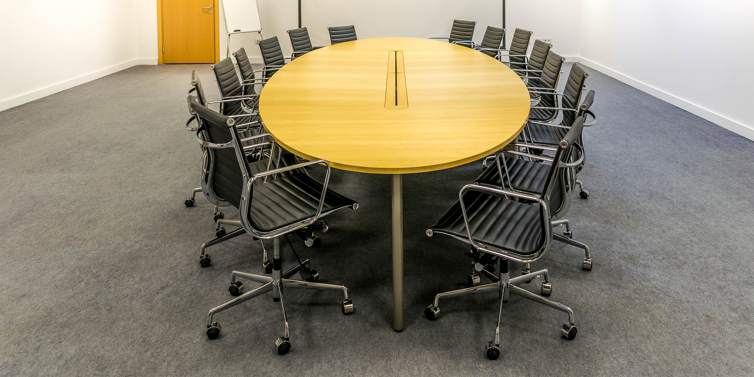 Eames EA117 Black Leather In A Meeting Room